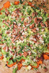 The slaw has been added to the baked sweet potatoes.