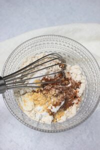Mixing the dry ingredients in a glass bowl.