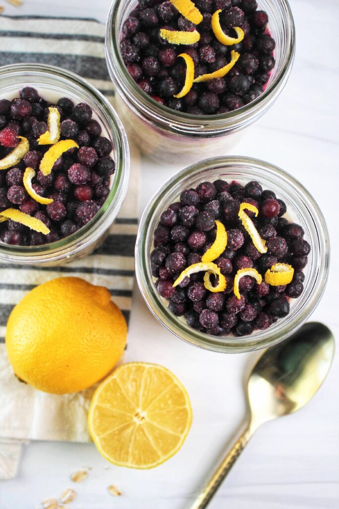 Just topped these overnight oats with frozen blueberries and lemon zest.
