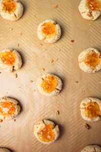 The cookies are on a baking sheet and just came out of the oven.