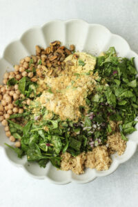 All of the ingredients have been added to a large bowl.