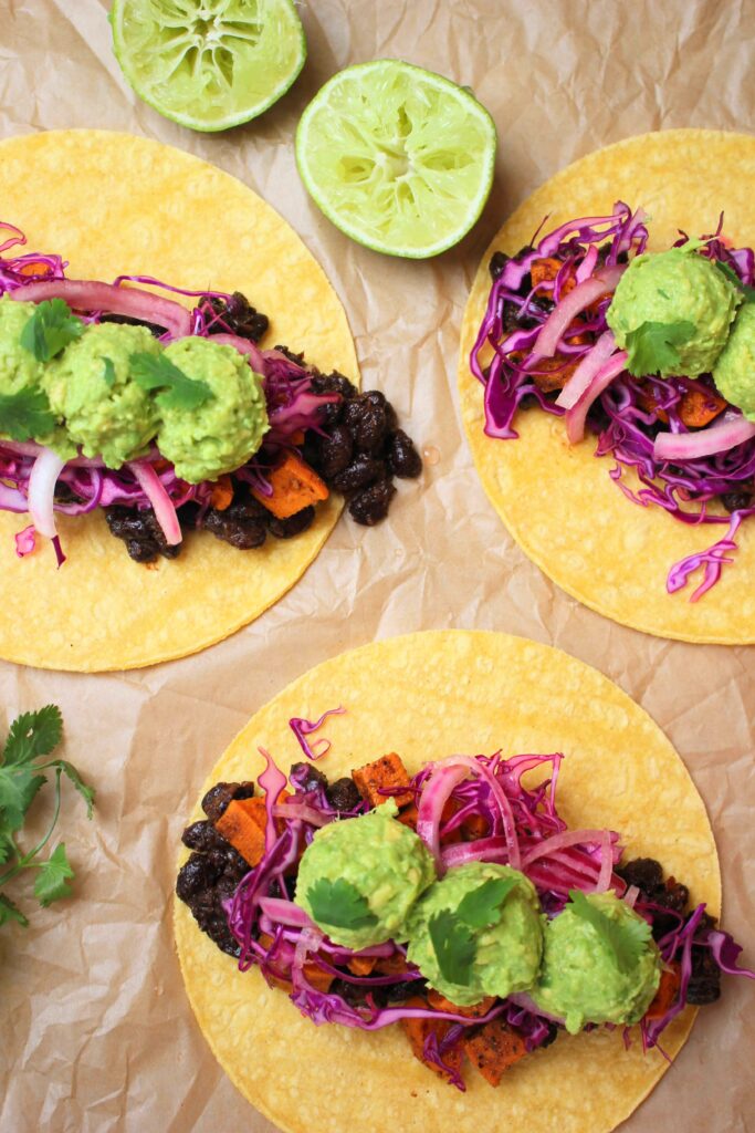 Three vegan tacos are all ready to eat.