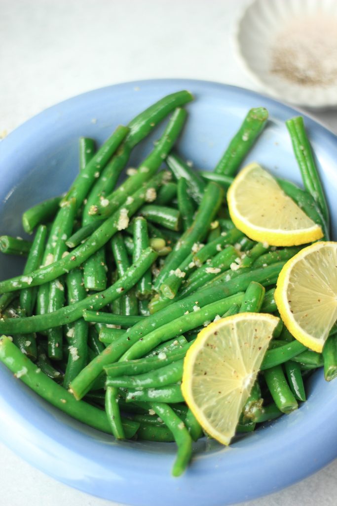 The green beans are in a bowl and are ready to enjoy.