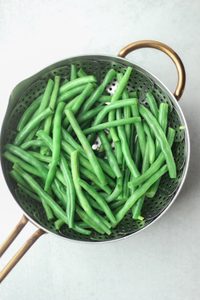 The green beans have been steamed in a pan.