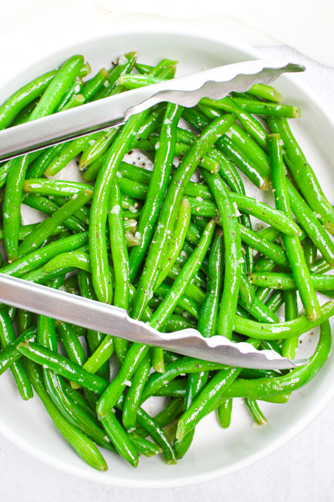 Green beans are in a bowl and ready to be served.