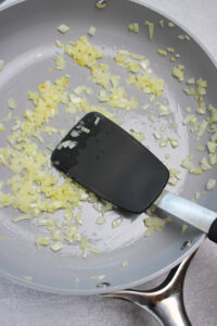 Sauteed onions in a pan.