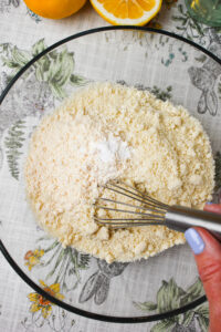 Mixing all of the dry ingredients in a glass bowl.