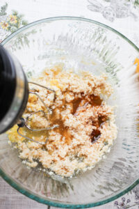 Using an electric mixture to blend the rest of the liquid ingredients. 