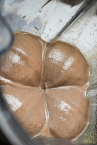 The black bean salsa is blended and creamy in the blender.