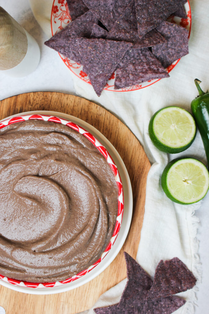 The black bean salsa dip is ready to eat with tortilla chips.