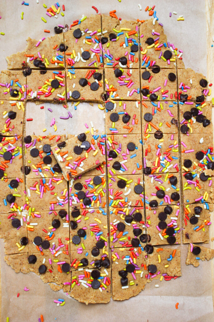 The cookie dough protein bites are cut up and ready to eat.