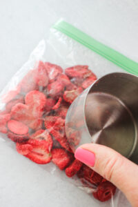 Crushing the freeze dried berries in a plastic bag.
