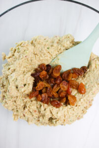 Added the raisins to the bowl of the chickpea mixture.