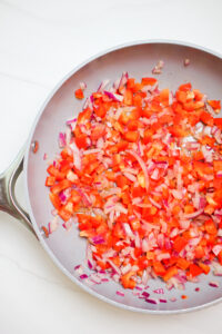 Frying the veggies in a saute pan over medium heat. They are ready to be added to the food processor. 
