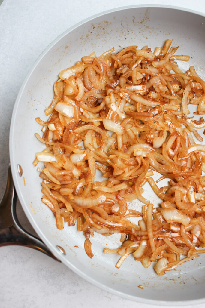 The onions are in the hot pan and are caramelized.