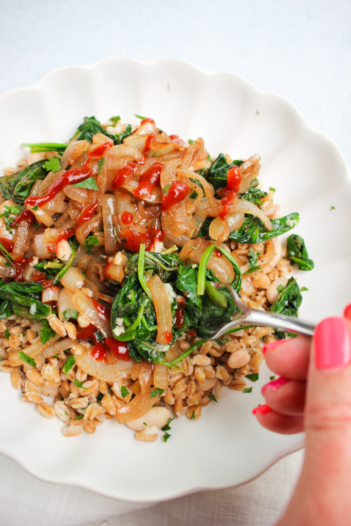 A forkful of this vegan farro and white bean dish.