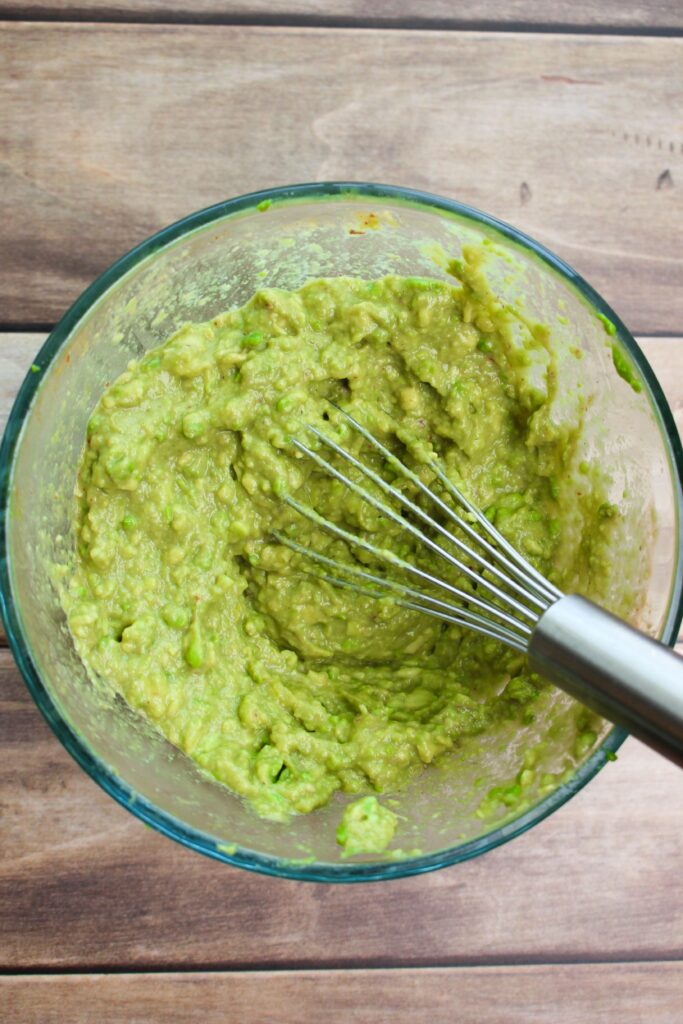 The guacamole whisked up in a small bowl.