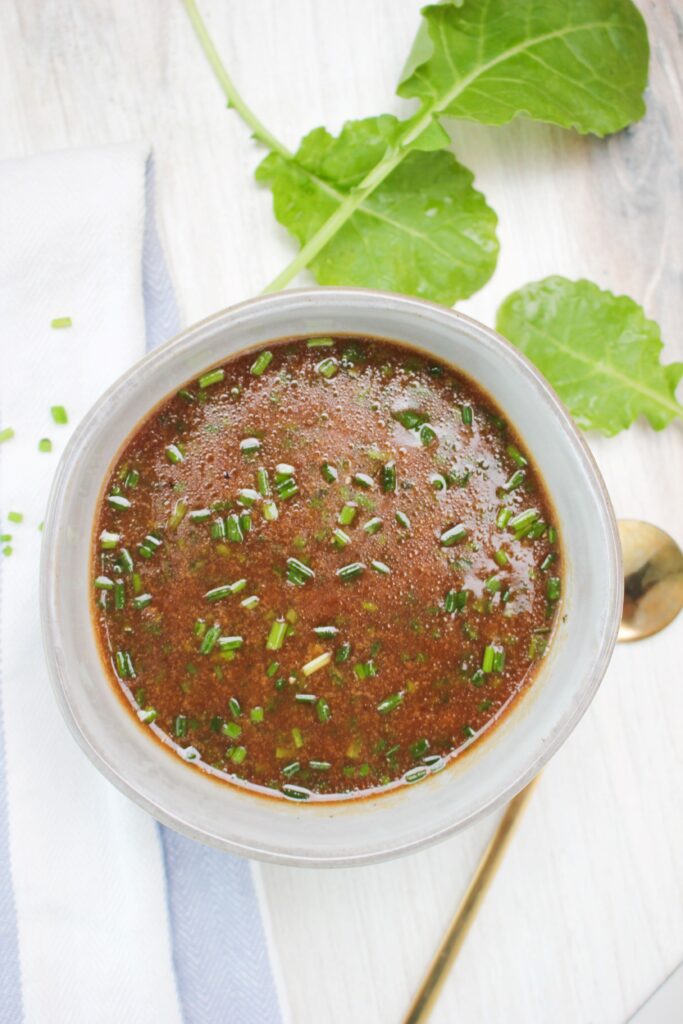 An up-close picture of the vinaigrette in a mason jar.