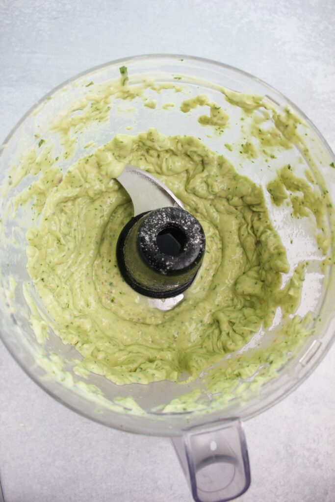 THe dip has been blended in the bowl of the food processor. 