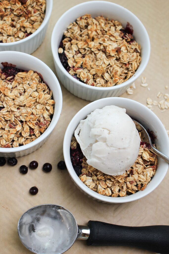 Just added a scoop of vanilla ice cream on a warm berry crisp.