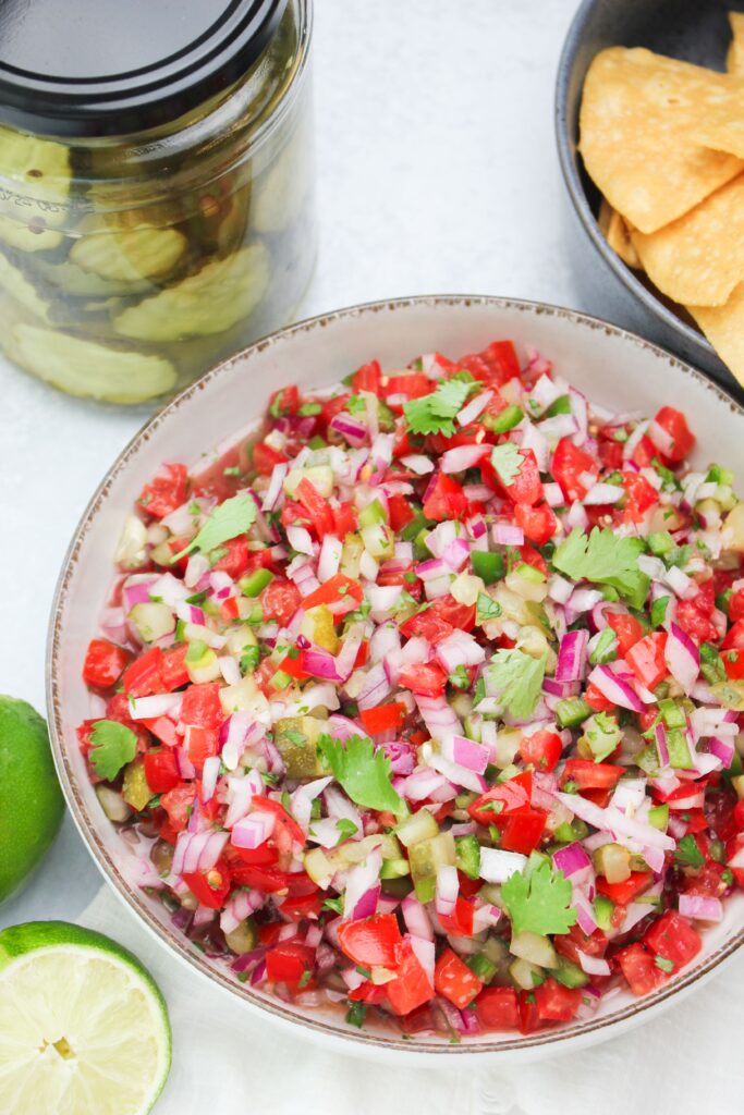 The salsa is in a serving bowl and is ready to serve. 