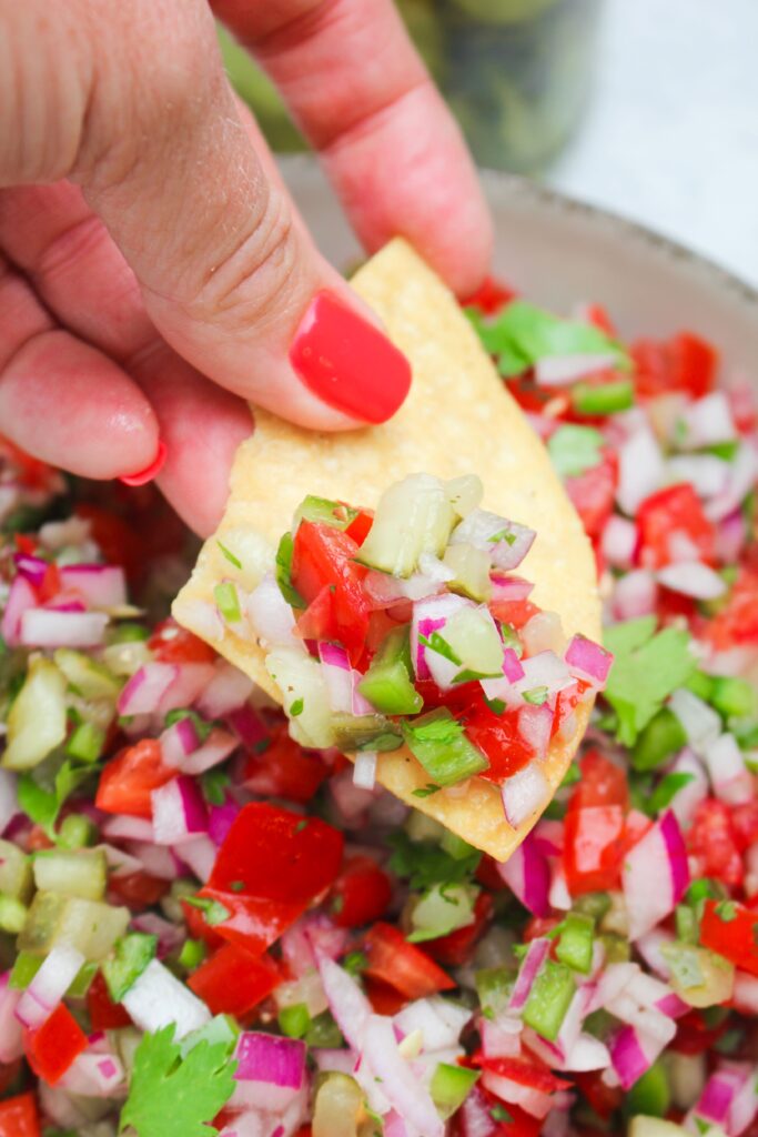 A tortilla chip dipped into this salsa. 