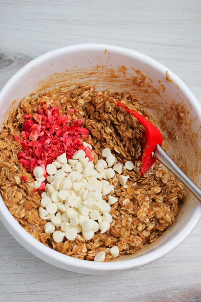 Adding the dry ingredients to the bowl of wet ingredients.