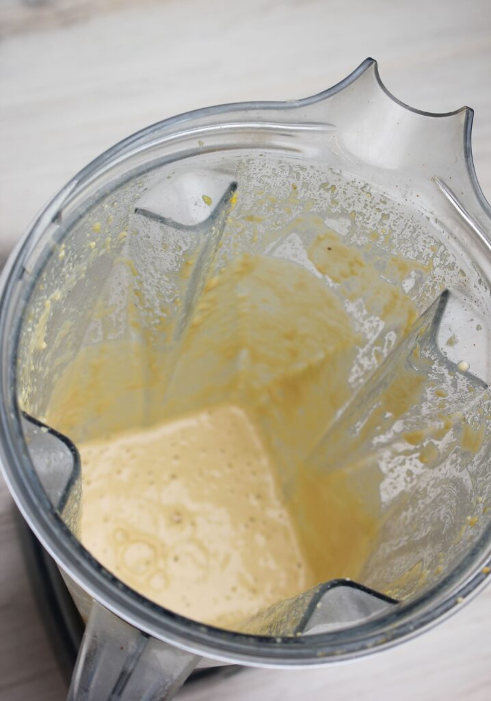 The dressing is all blended up in the blender.