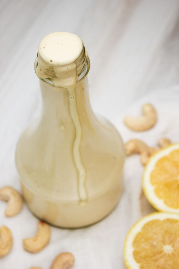 The dressing is in a glass jar.