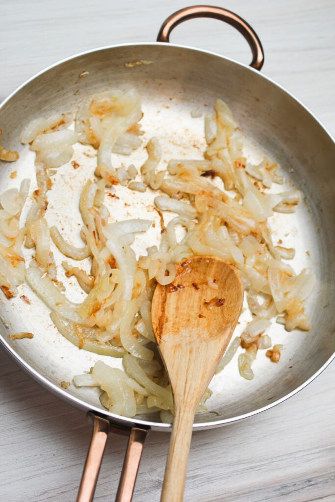 Grilling the onions in a suate pan.