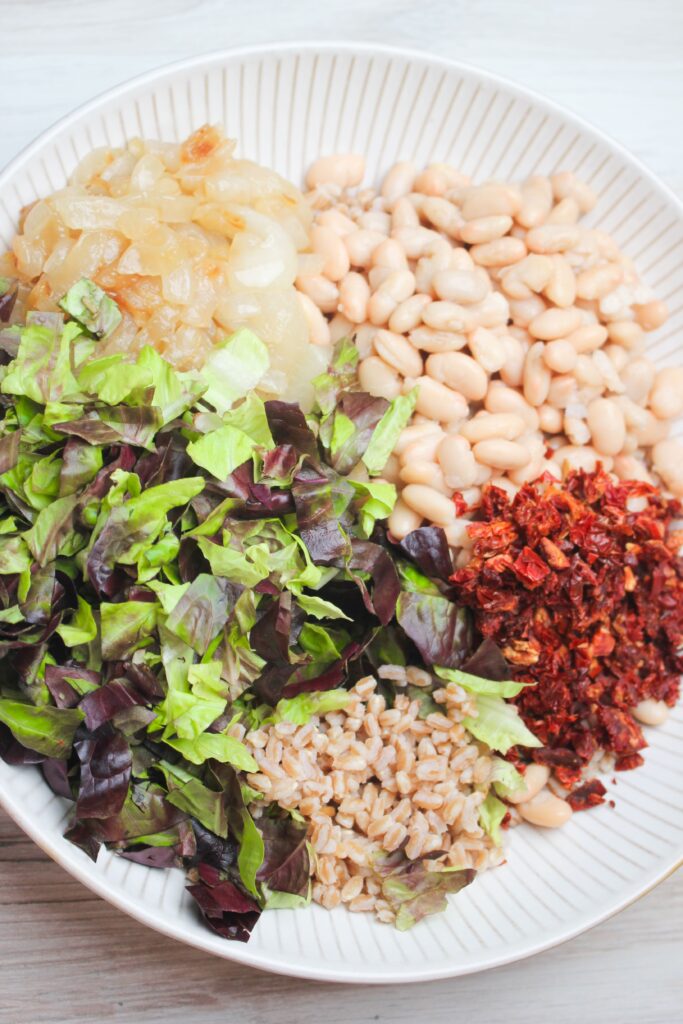 All of the salad ingredients are in a large bowl and are ready for the dressing. 