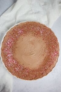 Just added candy cane dust and cacao powder over the top of the finished pie.