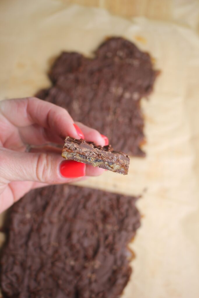 Holding one piece of this viral date bark.