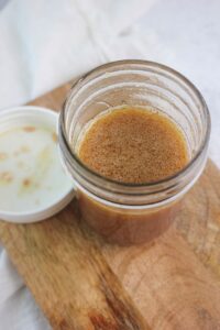 The Dijon Vinaigrette in a mason jar.