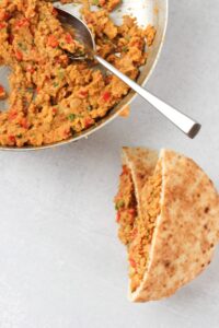 Stuffing the pita pockets with the falafel mixture.