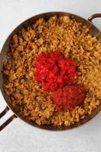 Just added salsa and chopped red bell pepper to the pan.