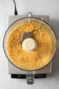 The cornflakes pulsed in the food processor.