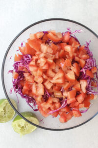 The slaw ingredients are in a bowl and are ready to toss.
