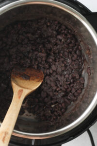 The black beans are done cooking in the pressure cooker.