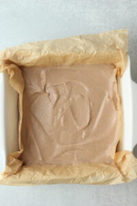 The date layer has been spread over the chocolate layer.