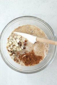 All of the ingredients in a glass bowl ready to be mixed.