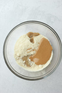 All of the ingredients for the peanut butter dough in a bowl.