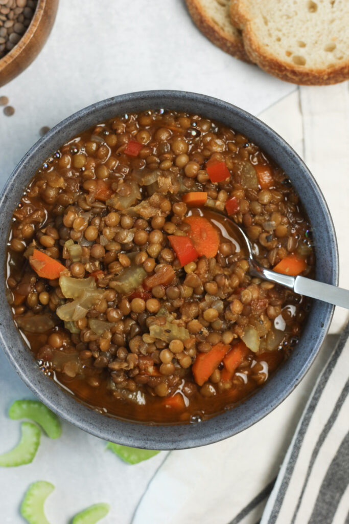 An up-close picture of the soup in a bowl with a spoon.