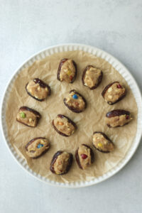 The dates have been stuffed with the peanut butter mixture.