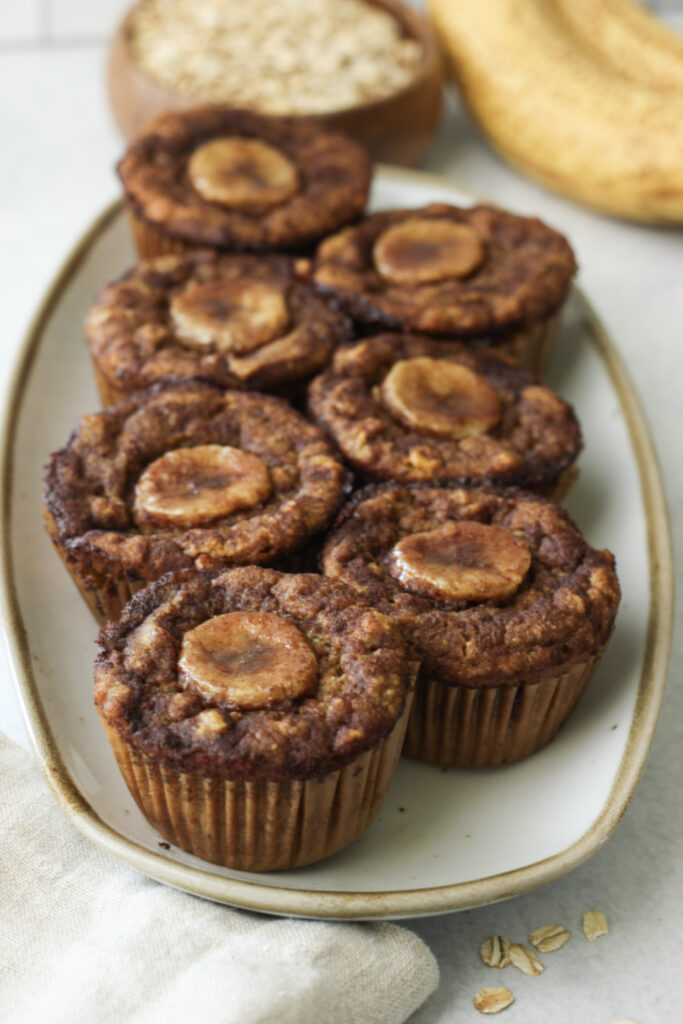 An up close picture of a plate of these pumpkin banana bread muffins.