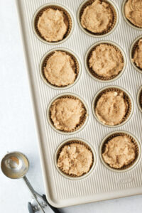 The mixture has been transferred into 12 cupcake liners.