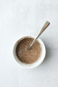 The flax egg is ready in a small white ramekin.