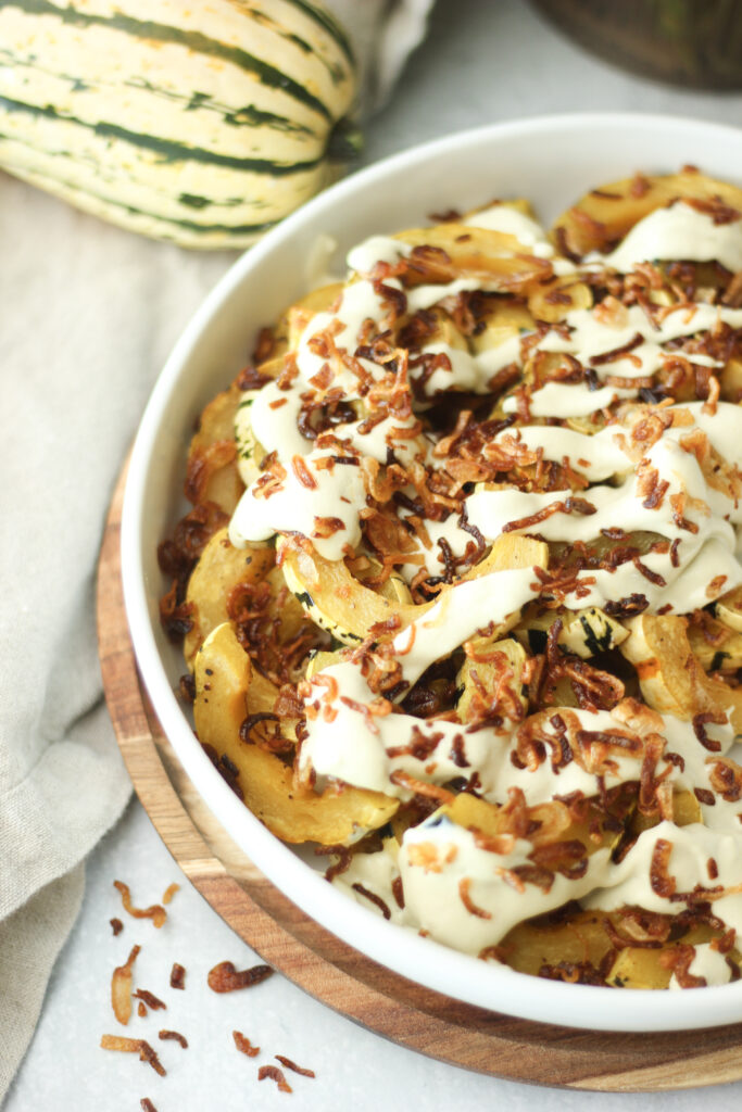 A bowl of the finished roasted Delicata squash is ready to eat.