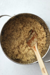 Cooking the quinoa in a saucepan.