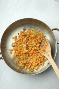 The Holiday Hash has been sauteed in a frying pan.